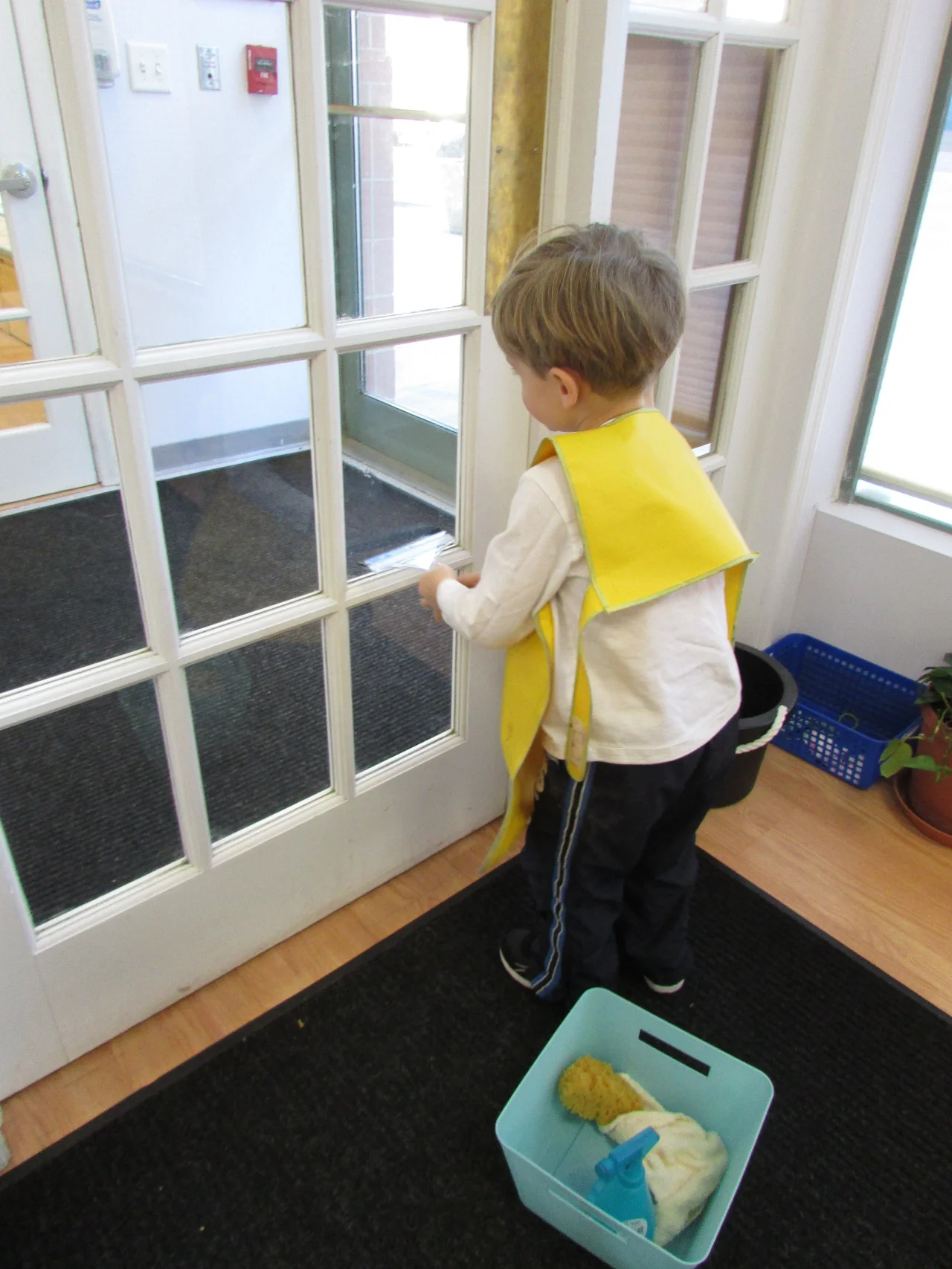 Window washing is a new and popular work in the Primary
3 classroom. The students enjoy
following each sequential step as they spray and wipe the glass and help to
keep their classroom clean. This work
helps to develop their independence and concentration.