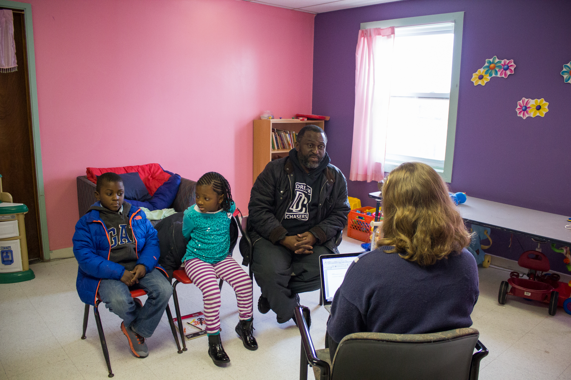  Al Custis, 42, is joined by his children Khabirah, 5,&nbsp;and Kheli, 9, as he shares his story during The Redline Project workshop at The Dixon House in Point Breeze January 16, 2016. 