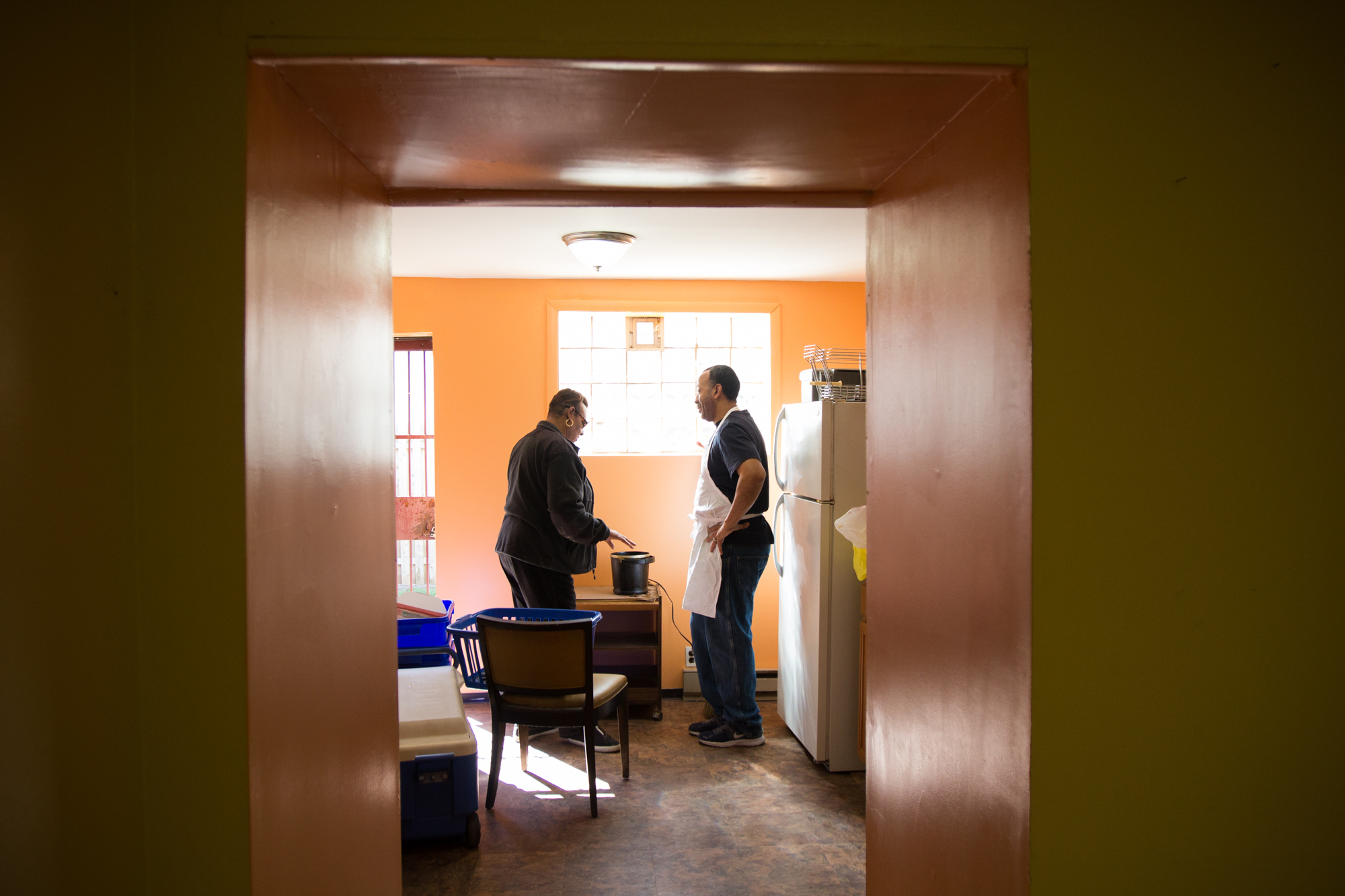  Helen Boggs and Michael Bell begin to prepare lunch during the third and final workshop of The Redline Project, held at the Neighbors in Action Association house in Point Breeze March 12, 2016.&nbsp; 