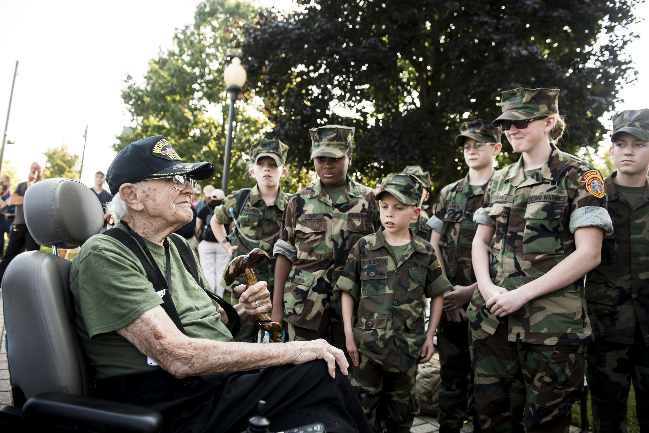  Members of the Hanover Area Young Marines talk with Lawrence "Gump" Bolin, 94, following a World War II reenactment. Bolin served as a private first class in the Army and landed on the beaches of Normandy on D-Day plus 6. 