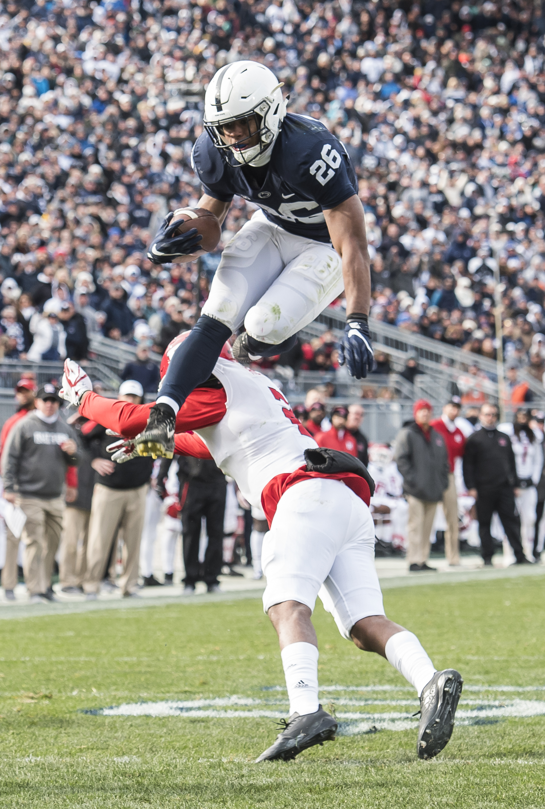  Penn State's Saquon Barkley hurdles Rutgers' Kiy Hester during an 11-yard run. Barkley finished the game with 35 yards and two touchdowns as the Nittany Lions won 35-6.  