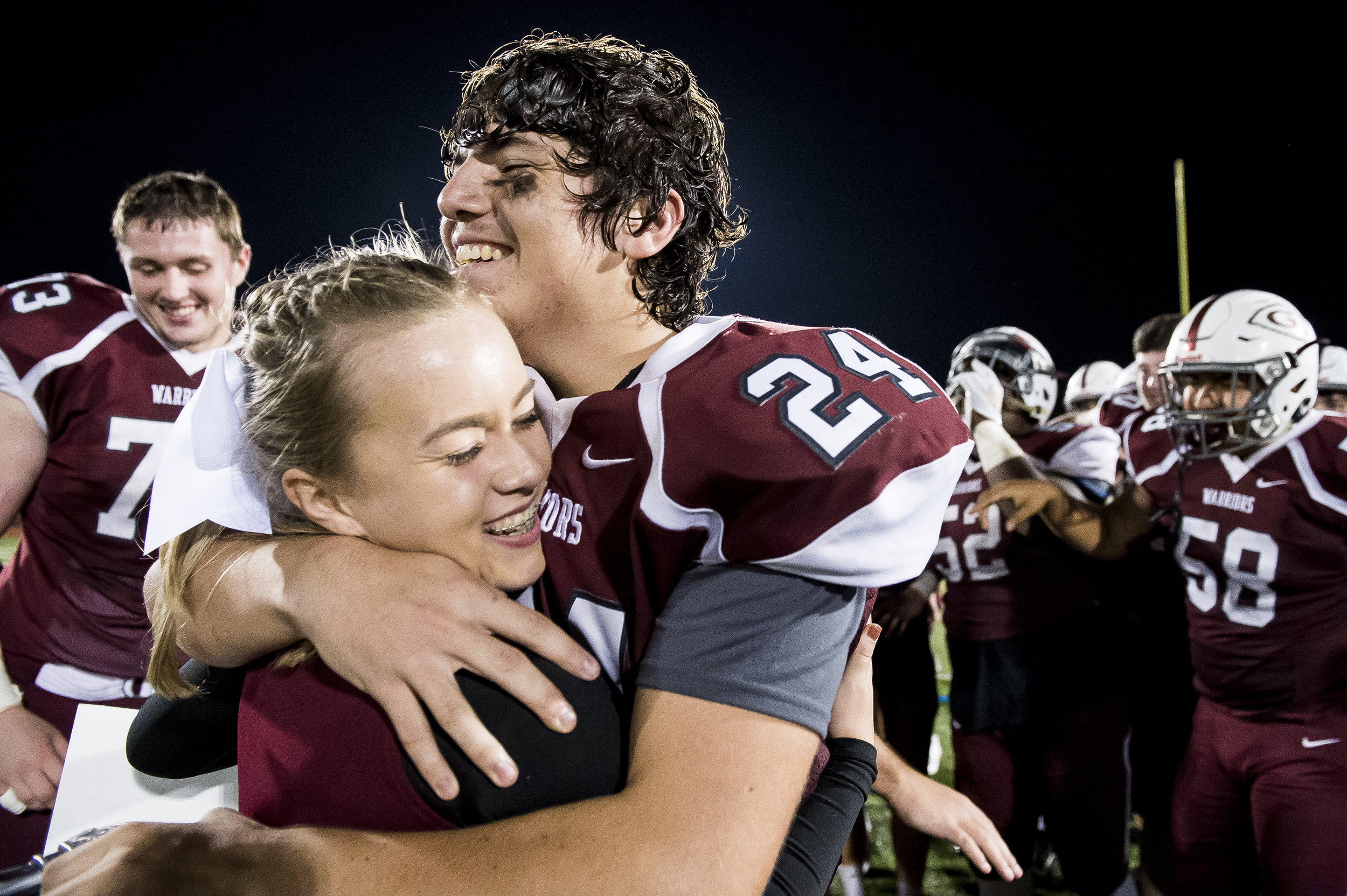  Gettysburg football player Alvaro Sanchez embraces his girlfriend, Veronica Yingling, after she surprised him with a homecoming proposal following a game against Eastern York.  