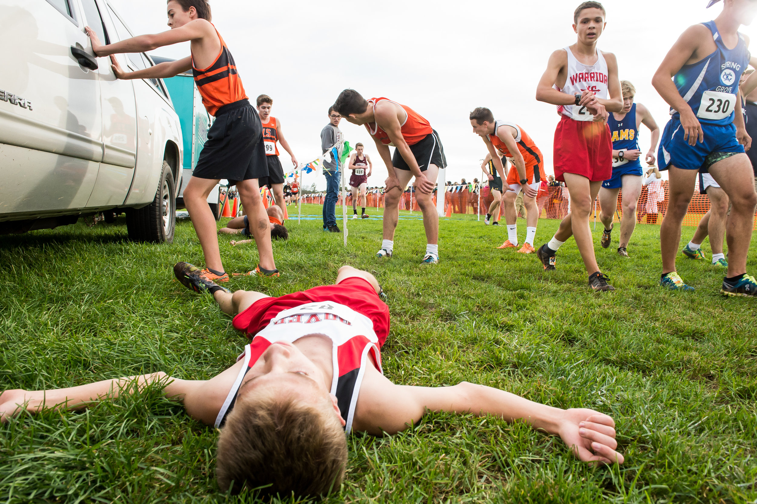  Dover's Tyler Rackley rests in the grass after competing in the YAIAA cross country championships at Gettysburg Area High School.  