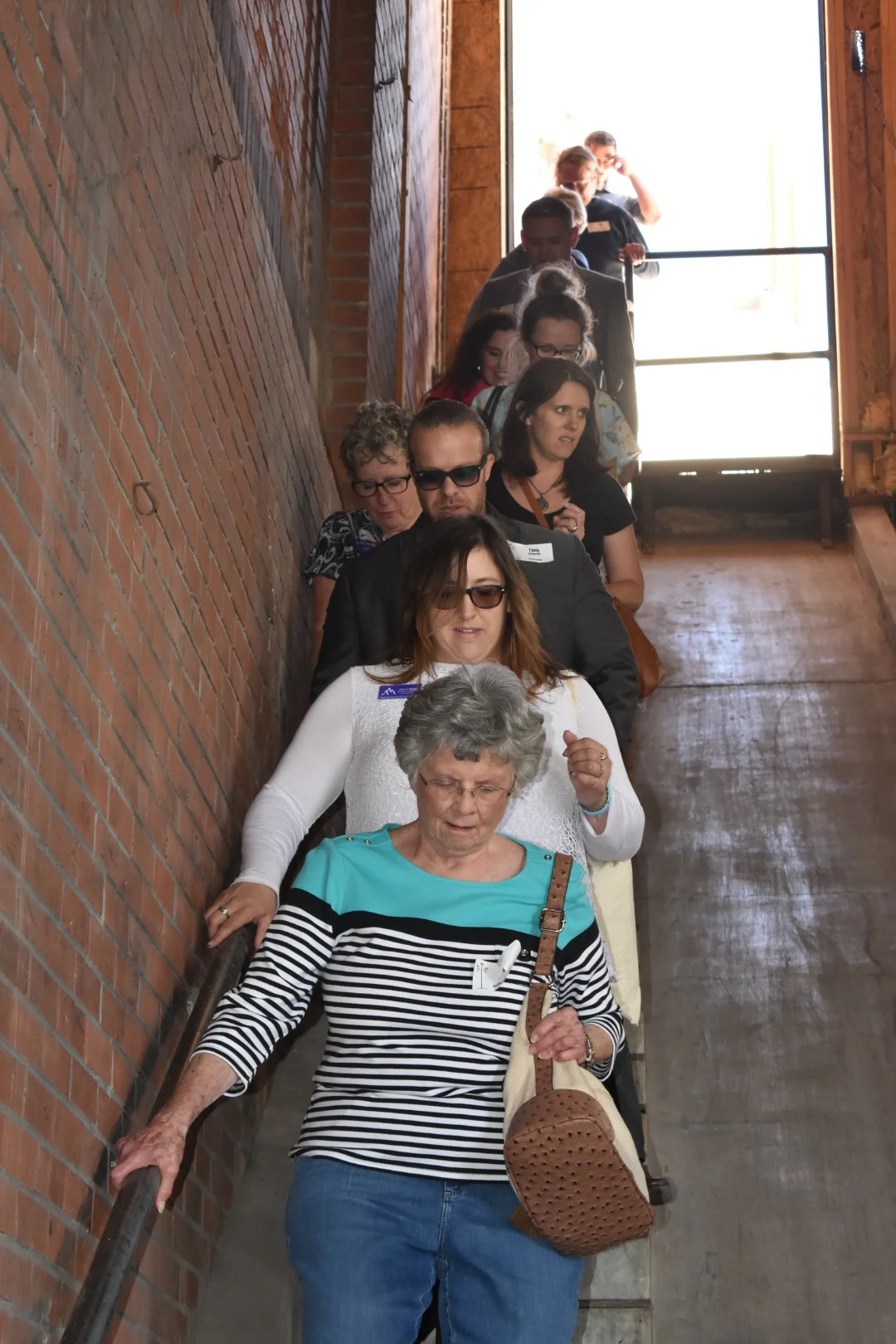 Tour participants exploring the former meat packing plant in the historic Grove neighborhood.