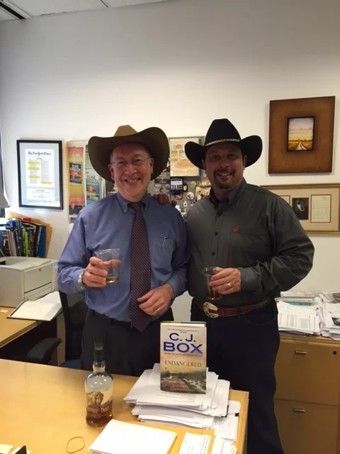 G.P.Putnam Editor-In-Chief Neil Nyren and CJB celebrate the news that ENDANGERED debuts at #2 on the New York Times Bestseller List