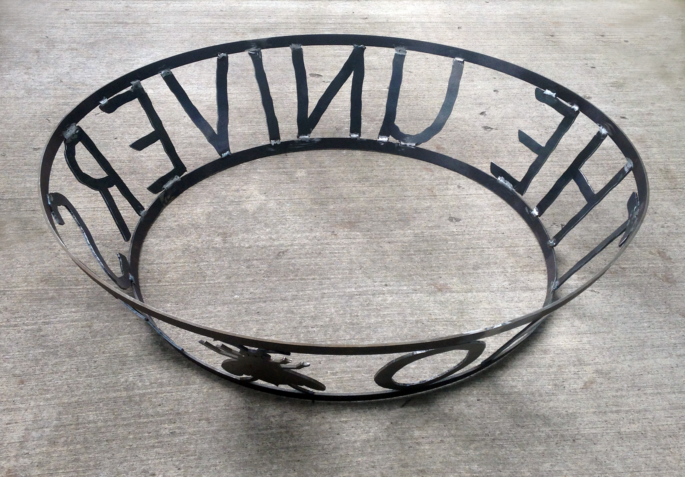 Base ring- with text "OF THE UNIVERSE" and Barbarini wasp ding bat.