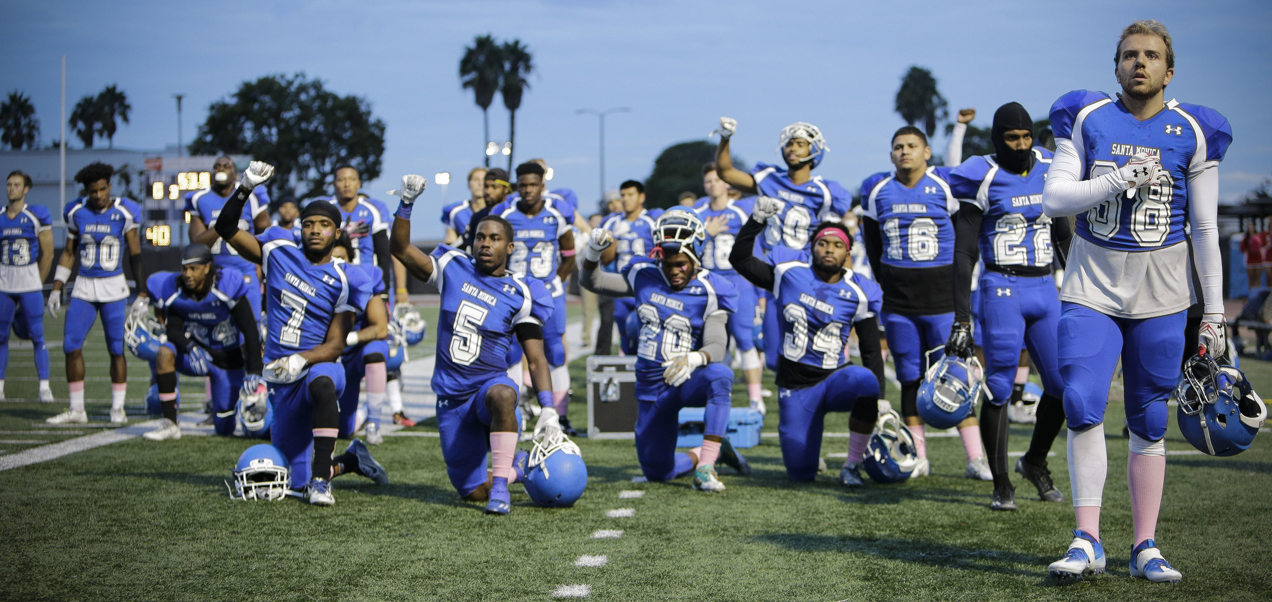  Teamates on The Santa Monica College Corsair mens football team continue to kneel in recognition for #BlackLivesMatter during the National Anthem before the teams Homecoming game. The Corsairs football team would loose at home 26-14 in Santa Monica 