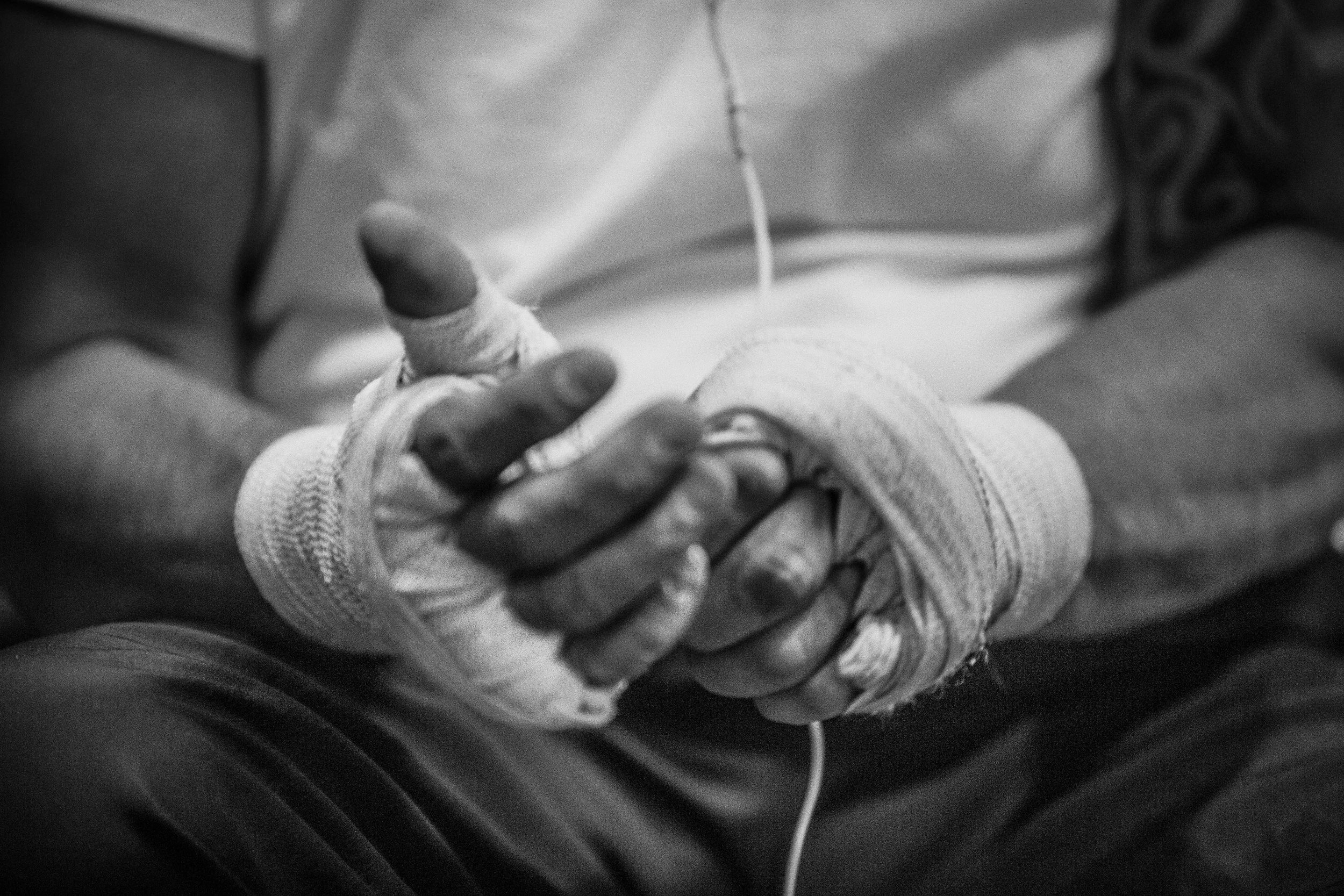  Juan Leonardo wraps his hands up beore putting on his boxing gloves, and starting his work out at the La Habra Boxing Club in La Habra Ca. on November 5th 2015. (Photo By: Daniel Bowyer/Sports Shooter Academt) 
