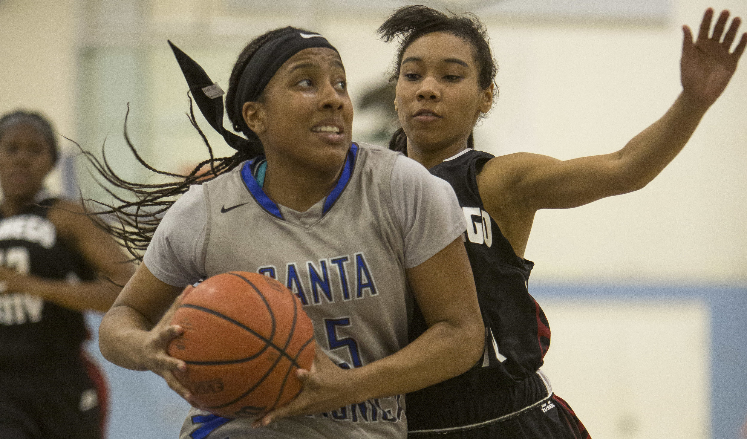  Feburary 22nd 2017 . The Santa Monica College Corsair Womens Basketball teams freshman forward (15) Lauren Davis  (grey,left) goes up for a layup to score against The San Diego City College Knight's freshman point guard #21 E'maniee Powell (black,ri