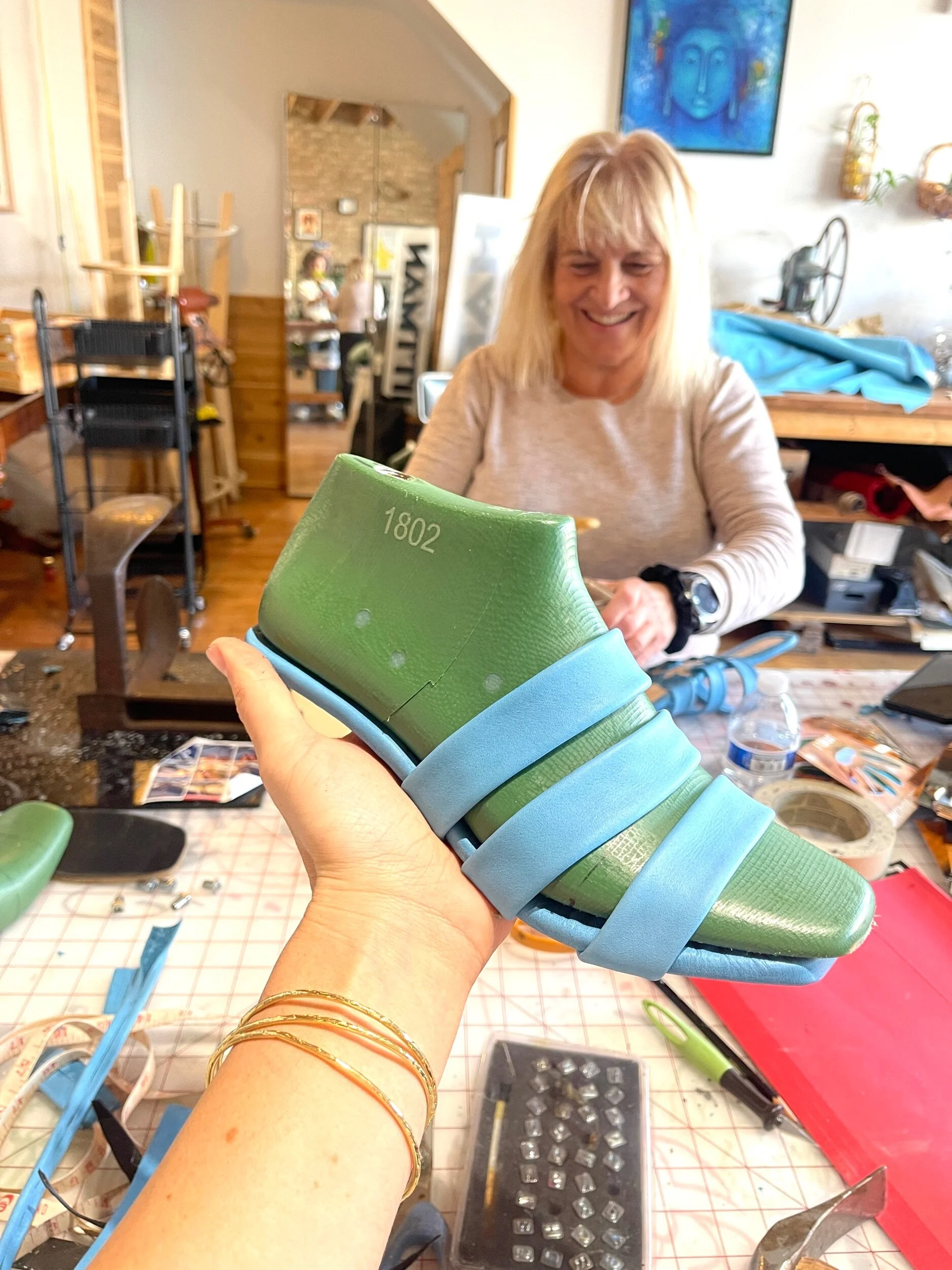 Making shoes making leather heels in blue leather
