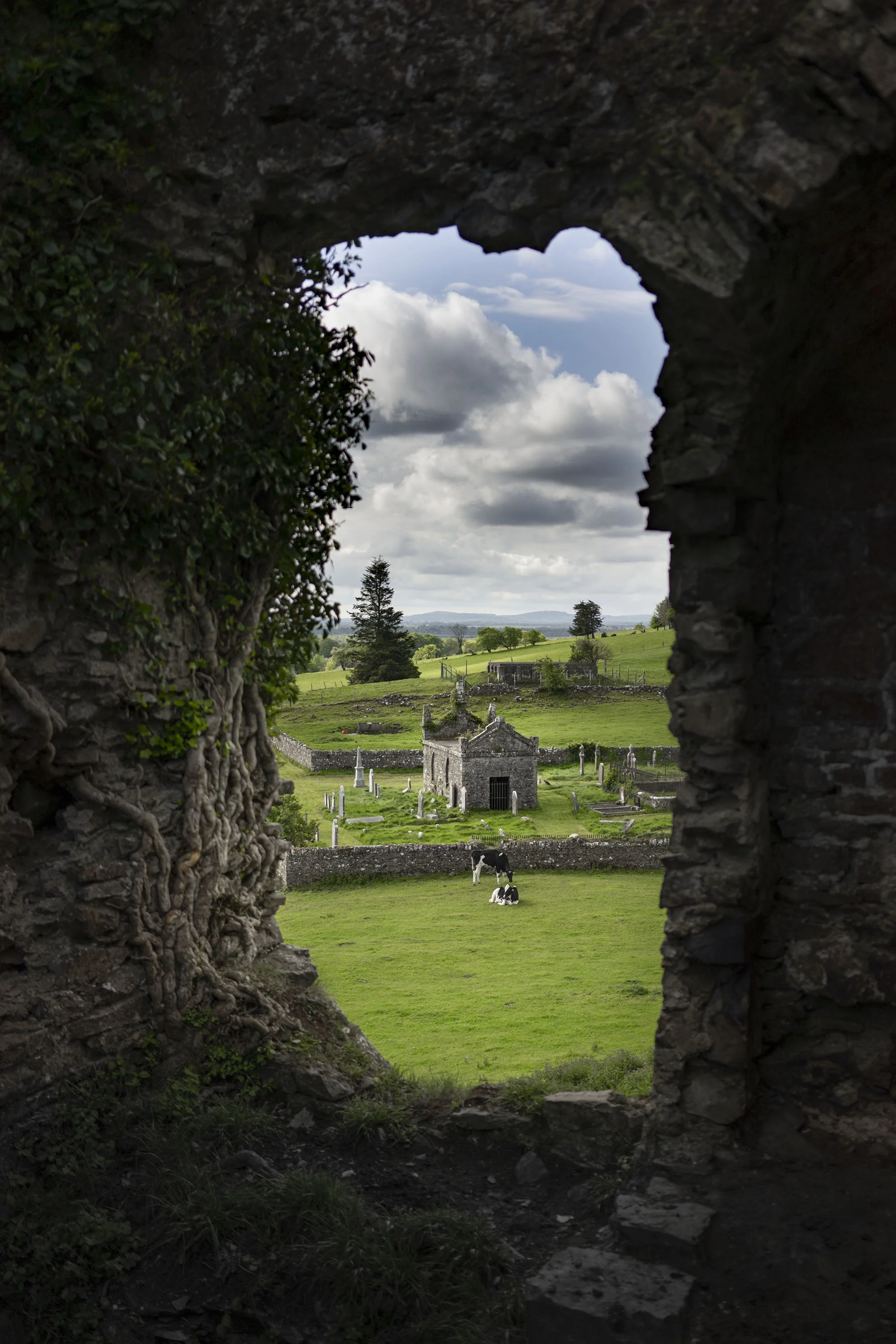 Graveyard through castle hole.jpg