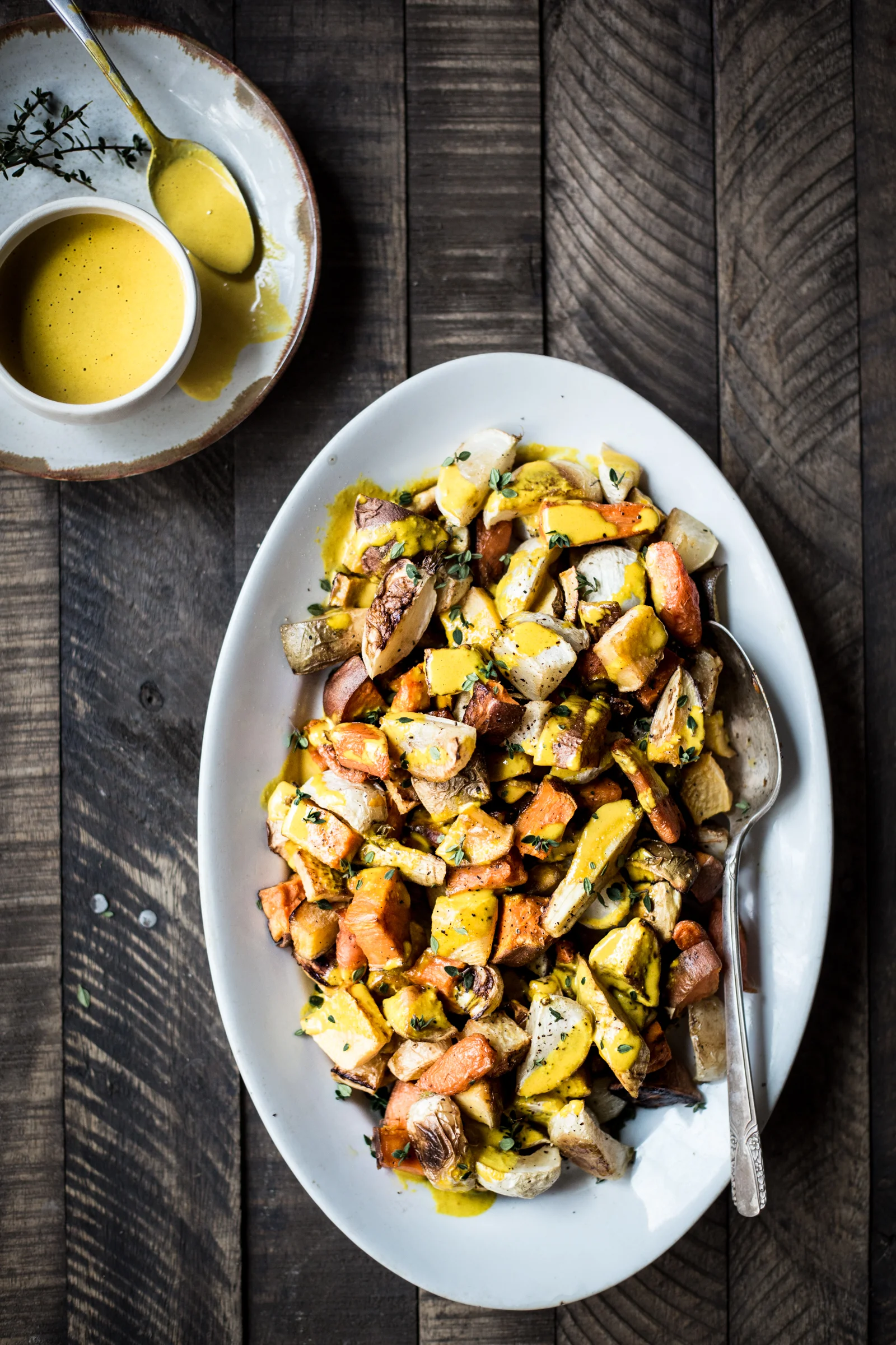 Roasted Root Veggies with Turmeric-Tahini Sauce (substitute the sweet potato with regular potatoes and add some winter squash to the mix for good measure!)