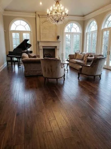 Dark hardwood flooring in a furnished living room