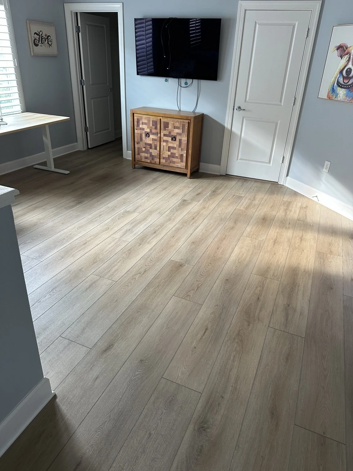 COREtec Genova Oak luxury vinyl plank flooring installed by Cardinal Floors in a room in Mallory Park, Bradenton