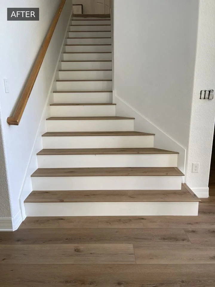 Completed staircase with wood-look treads and white risers, shown in the Cardinal Floors before-and-after video