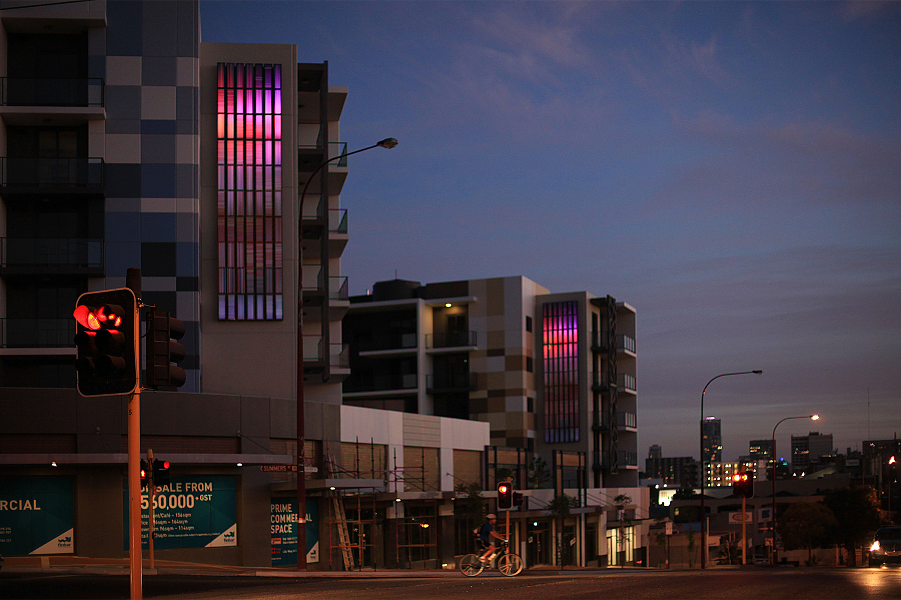 The artwork at 248 – 262 Lord St East Perth is themed around the idea of sky and particularly the horizon. The light boxes reference the sky through the use of colour and the way in which the three dimensional surface of the skin of each box creates shadows and is in turn, lit by the sun. Each artwork differs slightly in layout and colour. These colours change over a period of time to give a slowly changing night time experience.