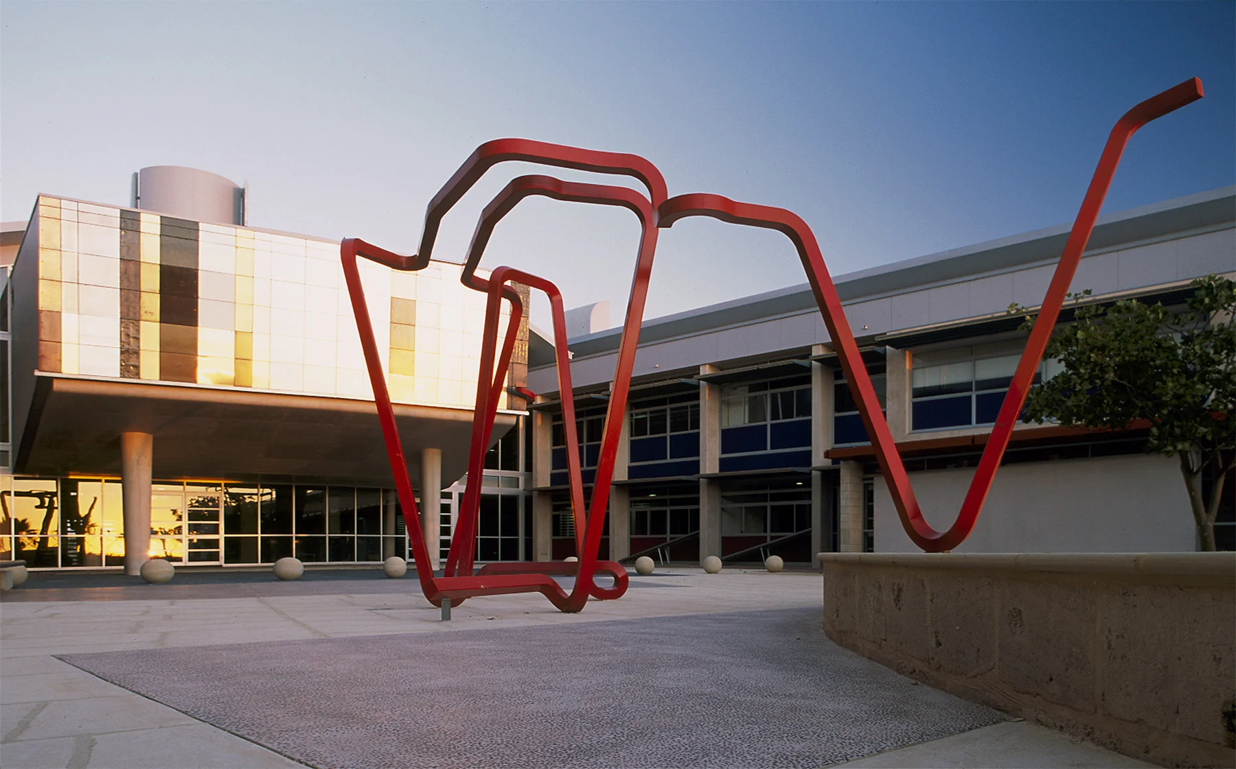 A Very Human Path is a work commissioned for Mindarie Senior College and embraces the idea of a student’s progress being not always straight, but always interesting. This work starts from within the school and springs from the lecture theatre to inhabit the main courtyard. This large work allows students to flow through its parts or sit or lean on the scything linear form. This red line forms a chaotic and playful illustration of the complexity (and ultimately positive) path for us all.