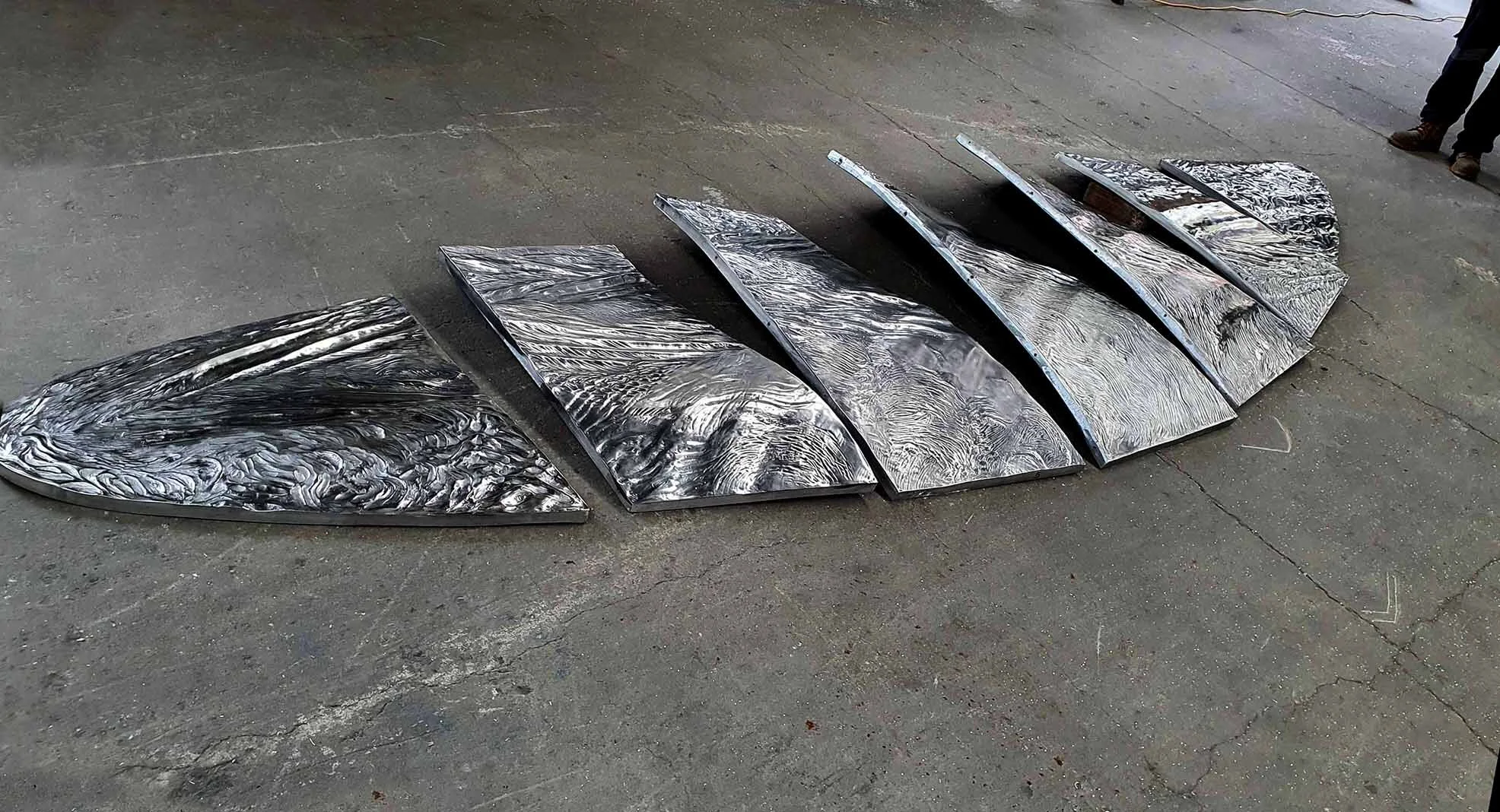  front artwork cast aluminium awaiting setting into fabricated shell 