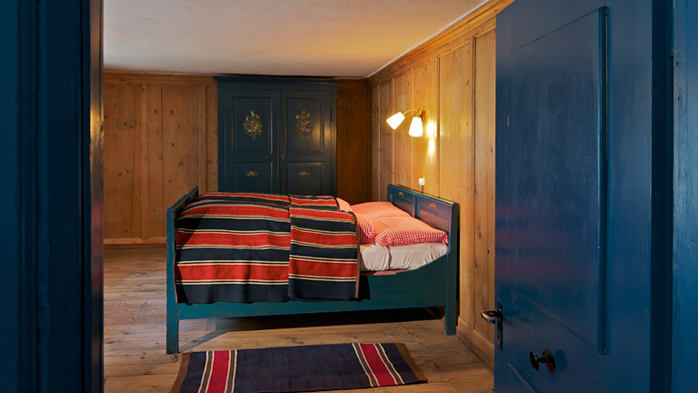 Room at Stazione Della Posta. Charming rooms with hand painted decorations. Shared vintage bath rooms with classic copper tubs and separate shower and toilet facilities. Single room: CHF 1450 Double room: CHF 1250