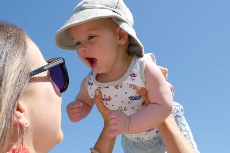 baby in sky aeroplane top