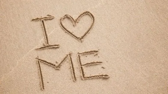 I heart me written in sand symbolizing importance of relationship with self on our partners.