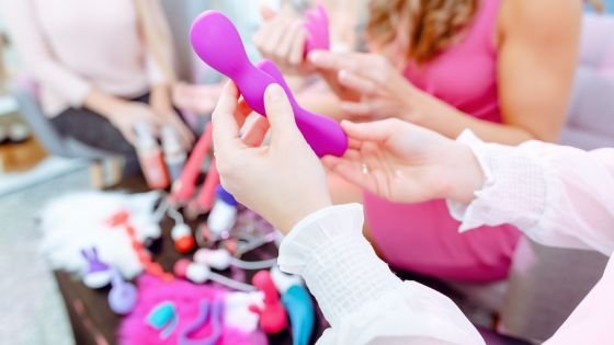 women looking at sex toys together as viable tools for pleasure with a partner.