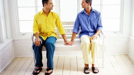 couple holding hands across a space indicating how to return to each other.