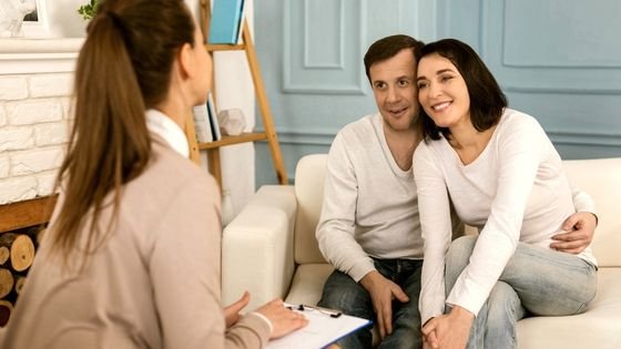happy couple in therapy, indicating therapists hope for their work.