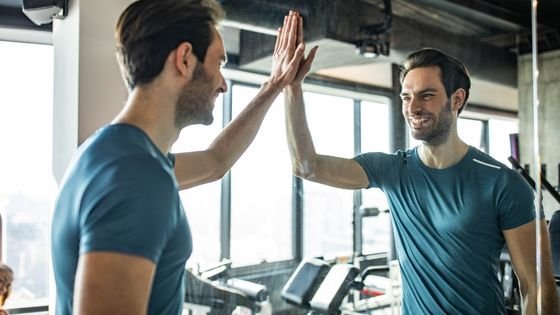 man looking proud of himself in the mirror symbolizing self-love