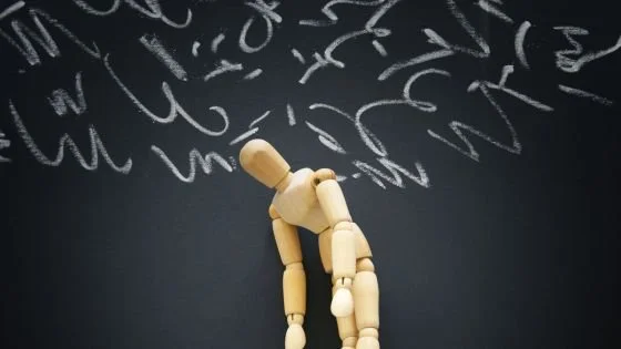drawing mannequin with squiggles overhead indicating a full brain while trying to have sex.