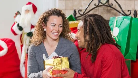 woman sharing a gift with partner from a different culture.