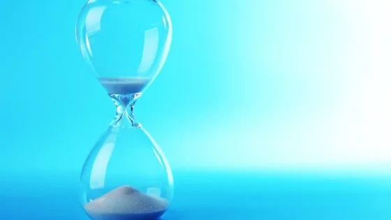 hourglass indicating why extended time matters in creating lasting change.