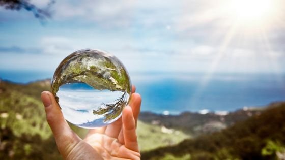 glass sphere symbolizing zooming out to see the patterns in conflict.