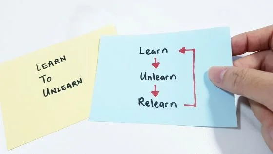 Sticky notes that show the process of learning unlearning and relearning.