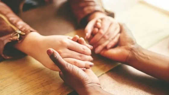 people holding hands indicating attempts at repair.