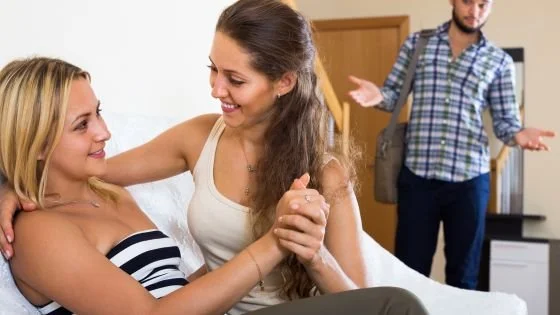 man walking in on two women together and looking okay about it indicates people having different comfort levels around physicality with others.