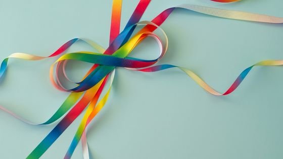 ribbons creating spectrum symbol indicating how being on the spectrum impacts sex.