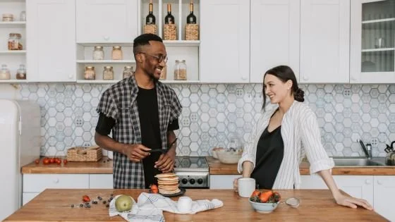 couple sharing affection over breakfast, an example of being present in unremarkable moments.