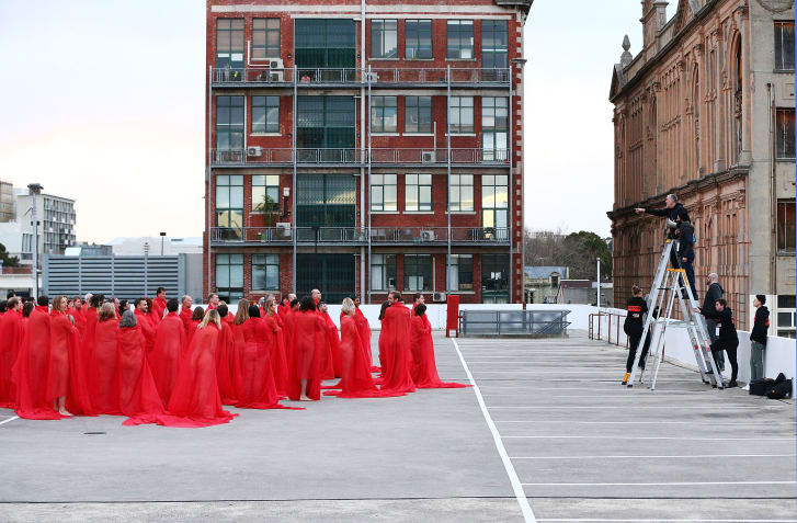 Around 500 people braved the Australian winter to pose for a series of controversial nude photographs on top of a Melbourne parking lot. The photo shoot, which was organized by American artist Spencer Tunick, took place this morning in temperatures of approximately 48 degrees Fahrenheit. It comes just weeks after supermarket chain Woolworths reversed its decision to ban the event from its premises.