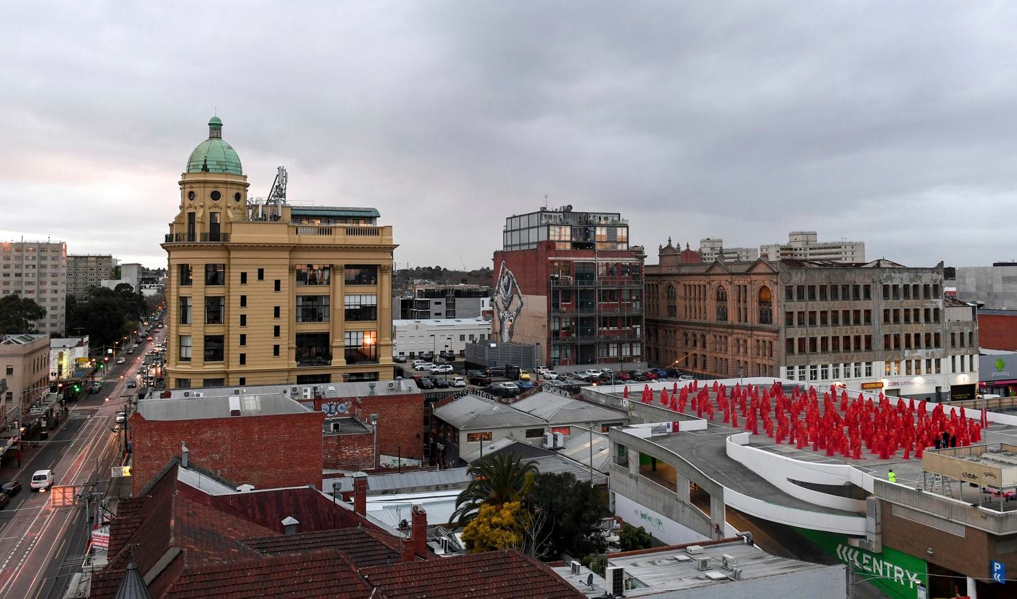 MEBOURNE, Australia — Up to 400 people stripped naked then draped themselves in see-through red fabric in a Melbourne city car park on Monday to pose for U.S. photographer Spencer Tunick. A supermarket had initially refused the photographer renowned for large-scale nude crowd shots around the world permission to use its rooftop car park in the inner suburb of Prahran. But the retailer relented in the face of a public backlash, with 12,000 people applying to take part. Chloe Horler said she felt lucky to be included among the hundreds of men and women who stripped in 9 degree Celsius (48 degree Fahrenheit) morning cool in Australia’s second-largest city.