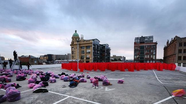 A SEA of shivering, stark-naked Melburnians have gathered on a rooftop to be photographed by US artist Spencer Tunick this morning. The New York-based Tunick held one of his famed mass nude shoots atop a Woolworths car park in Prahran. Last month, Woolworths rejected the plan but had a change of heart a few days later .