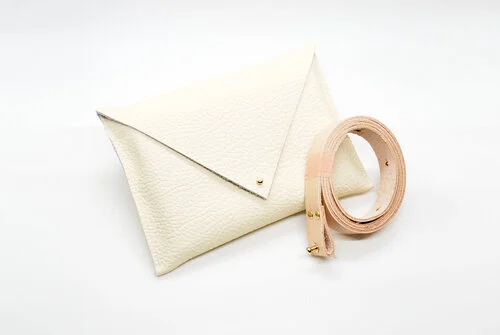 Ivory Leather Belt bag with natural rawhide leather belt and gold accents.