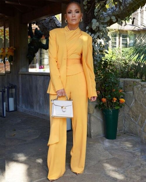 Jennifer Lopez, a vision in yellow. photo via RedCarpet-FashionAwards.com