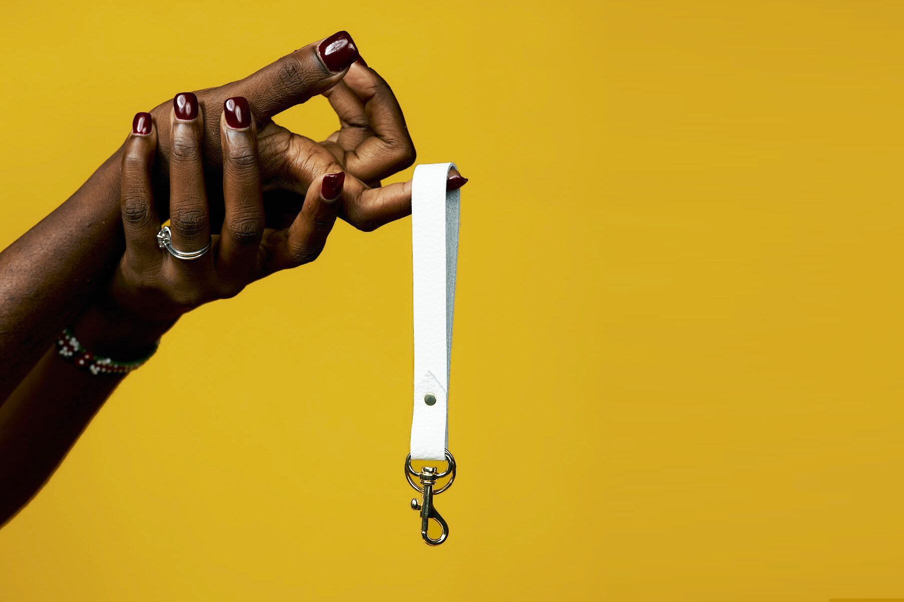 white leather wristlet