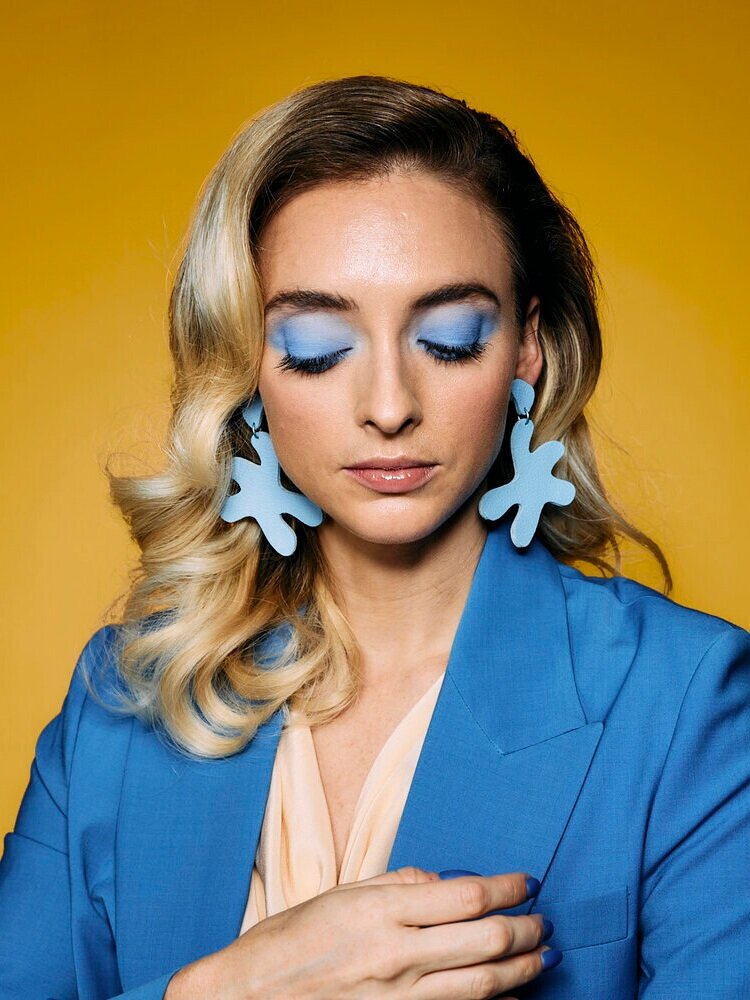 Cold Gold oversized leather statement point move earrings in periwinkle.