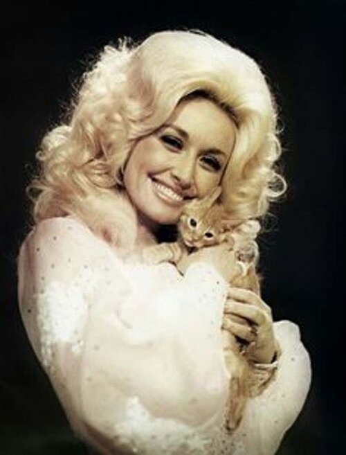 Dolly Parton holds the luckiest kitten on the planet, via Pinterest.