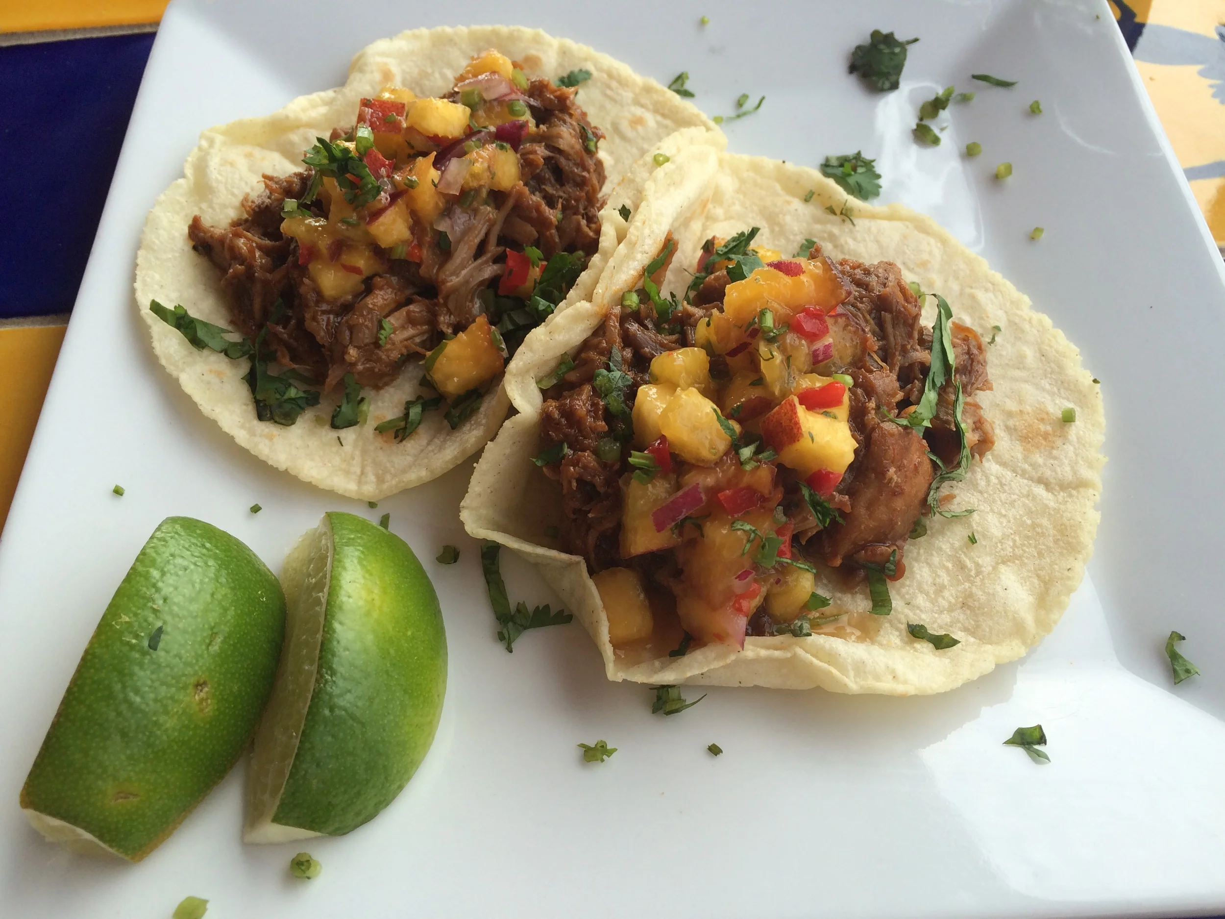 pulled pork tacos with peach salsa at alma
