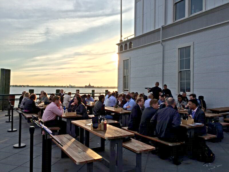 picnic table seating overlooking new york harbor at pier a harbor house