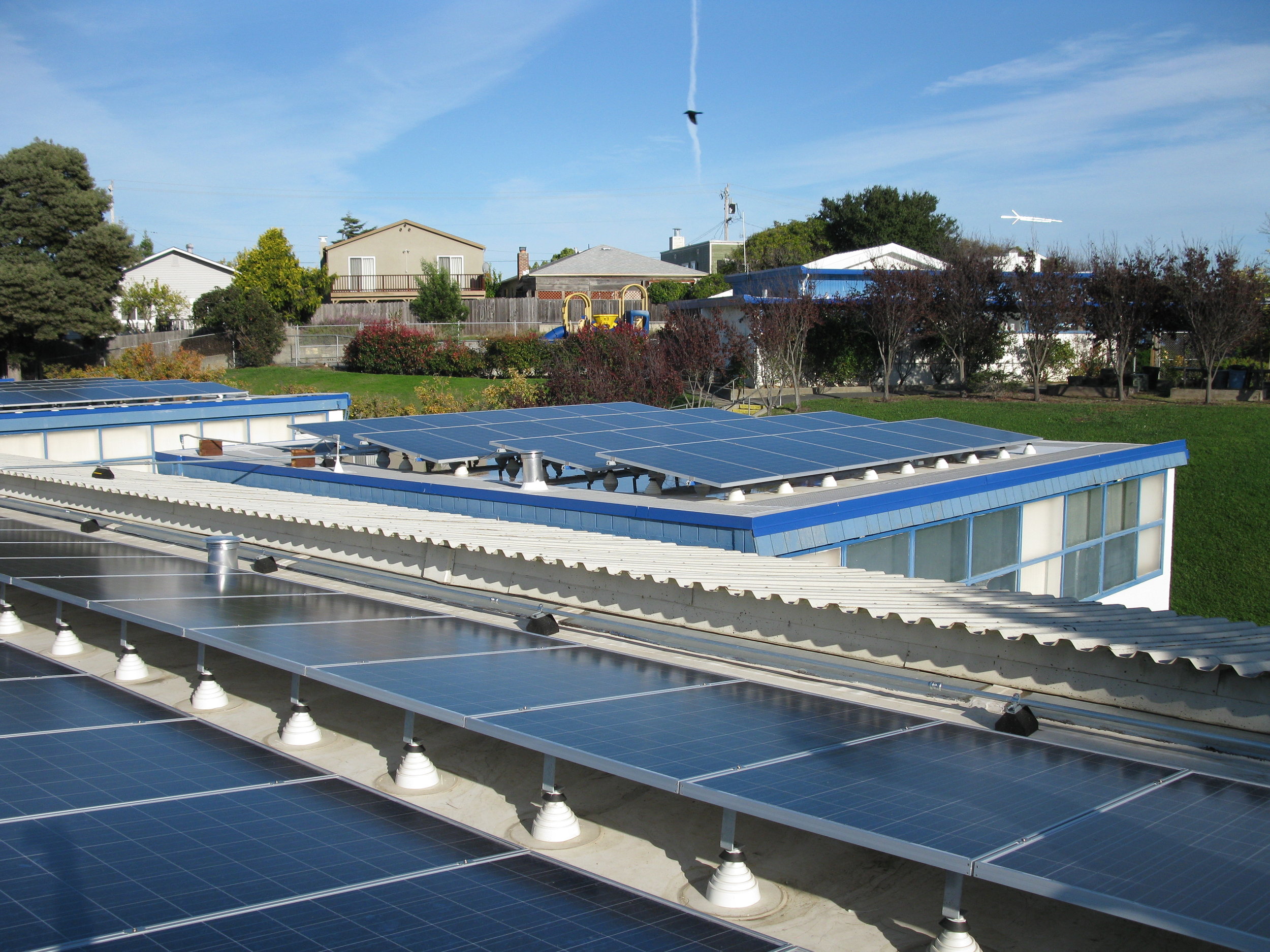 Flat roofs require additional weight to ballast the PV system.