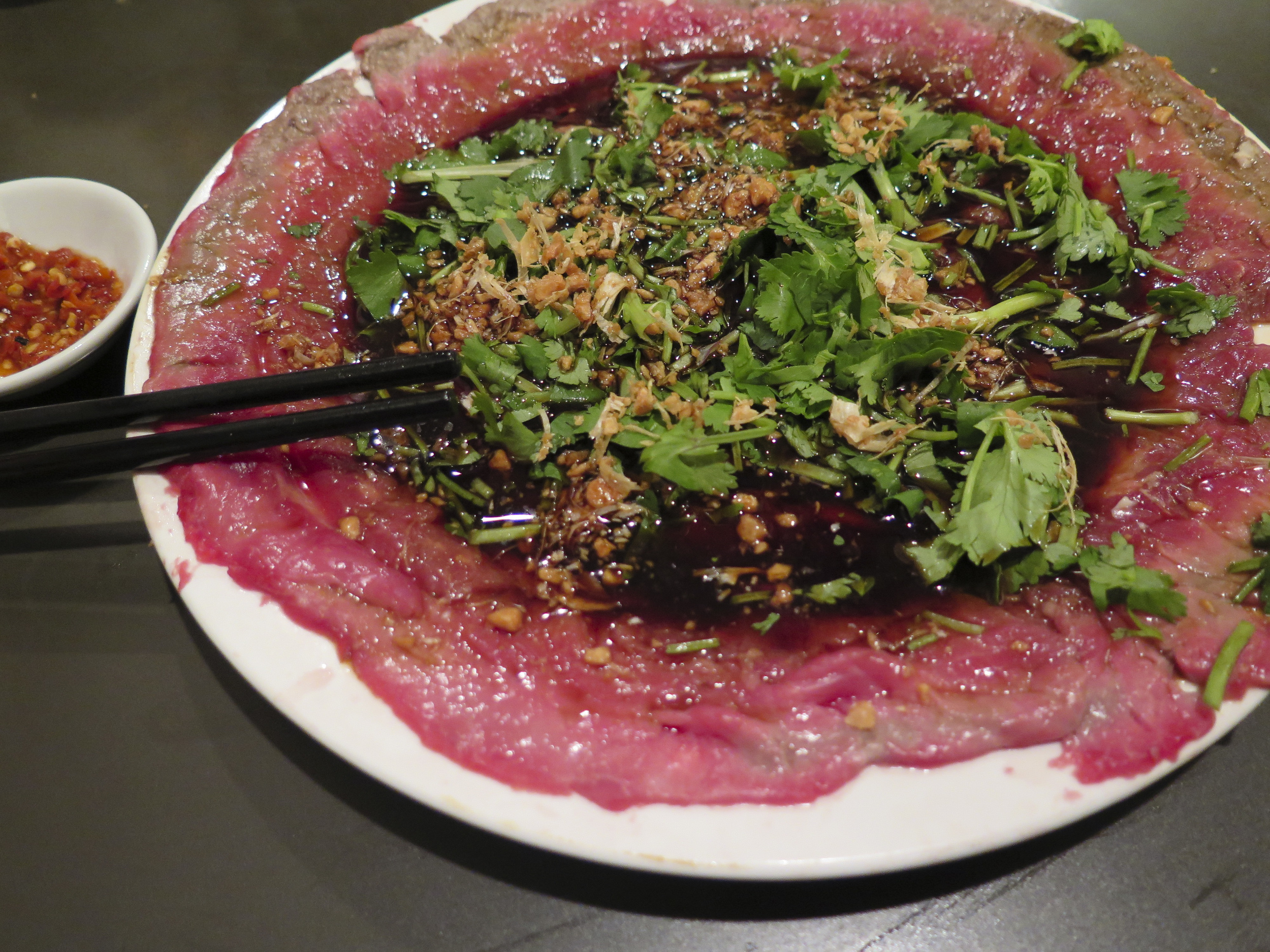 Famous Buttered Beef. Lightly seared and almost a carpaccio this dish was insanely delicious with a pop of asian spices and flavor.